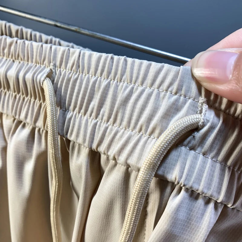 Summer thin ice silk men's shorts trend Korean version casual sports loose quick drying breathable mid pants